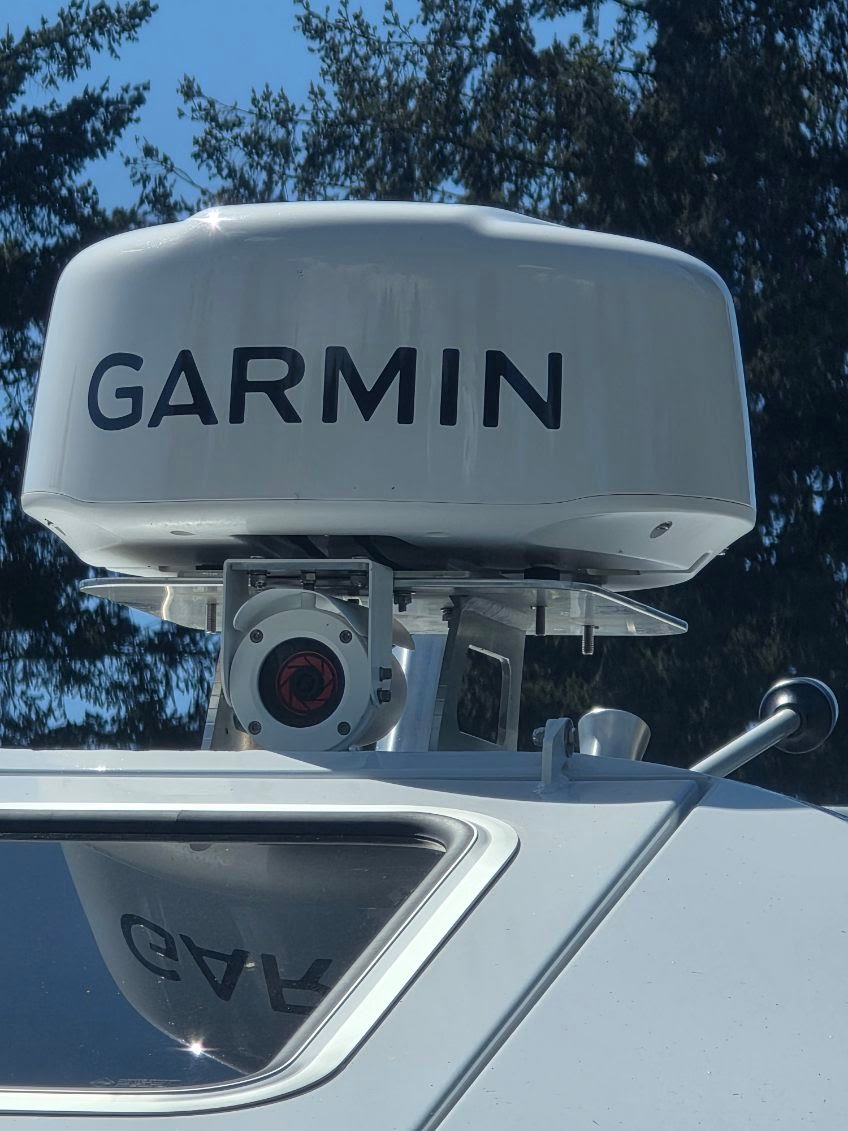 Radar arch mount under a Garmin dome on a sportfish